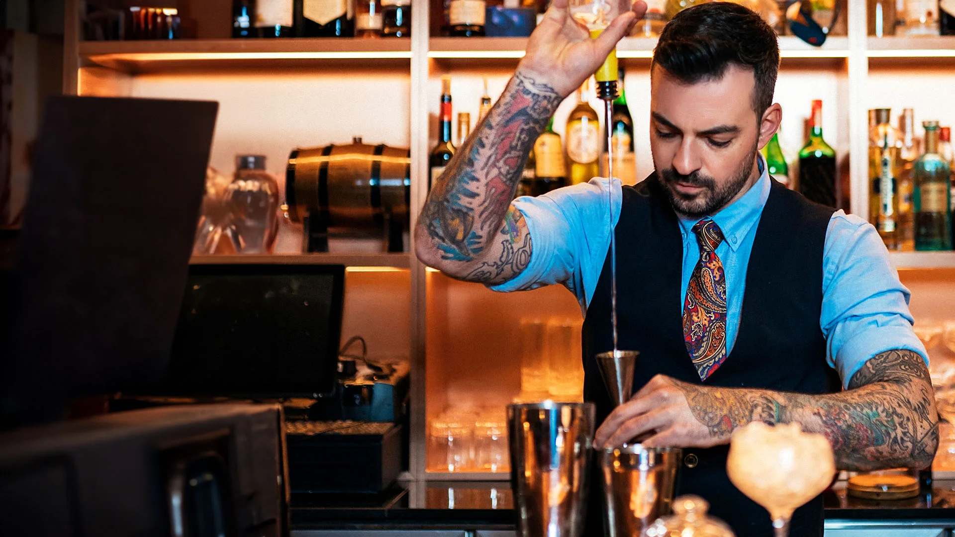 Australian bartender crafting cocktails in a hospitality venue